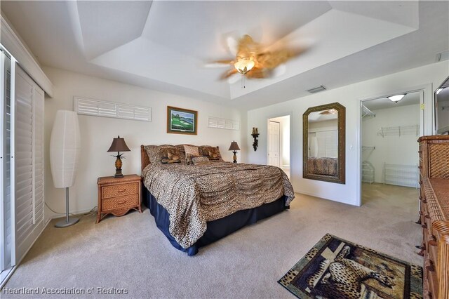 bedroom with light carpet and ceiling fan