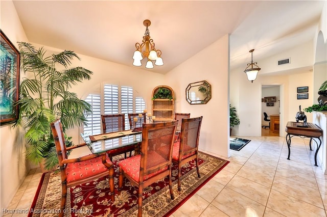 tiled dining room featuring vaulted ceiling, a notable chandelier, and visible vents