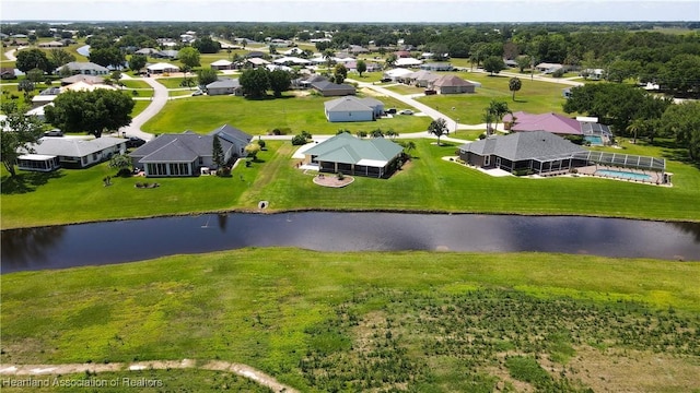 drone / aerial view with a residential view and a water view