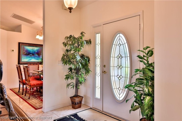 entrance foyer featuring visible vents and light tile patterned floors