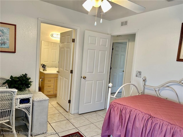 bedroom featuring ceiling fan and light tile patterned floors