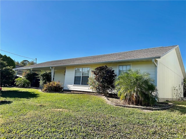 view of front of property with a front lawn