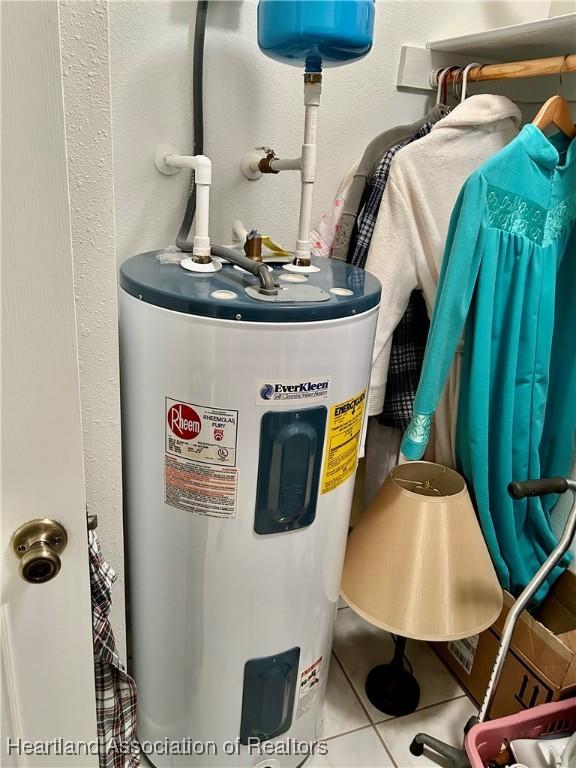 utility room featuring electric water heater