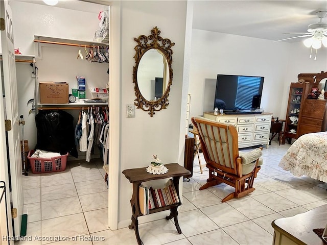 bedroom with a closet and light tile patterned floors