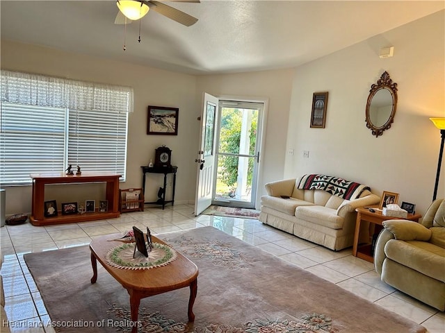 tiled living room with ceiling fan