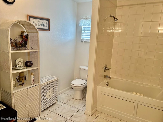 bathroom with tile patterned flooring, tiled shower / bath combo, and toilet