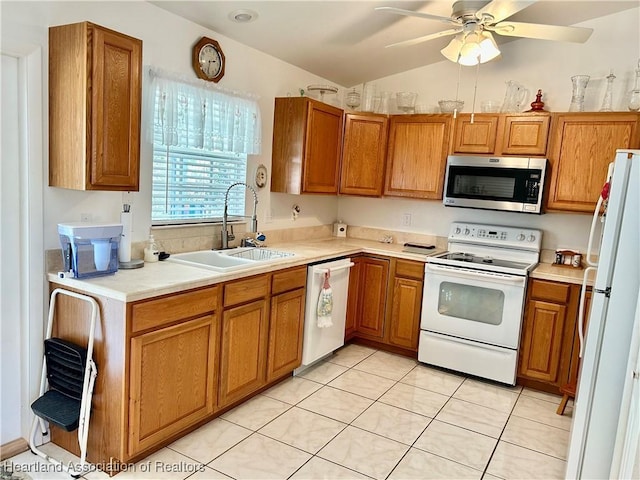 kitchen with white appliances, light tile patterned floors, ceiling fan, sink, and lofted ceiling