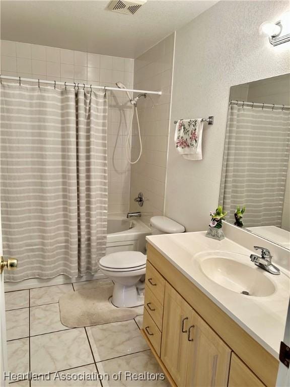 full bathroom featuring toilet, tile patterned flooring, shower / bath combination with curtain, and vanity