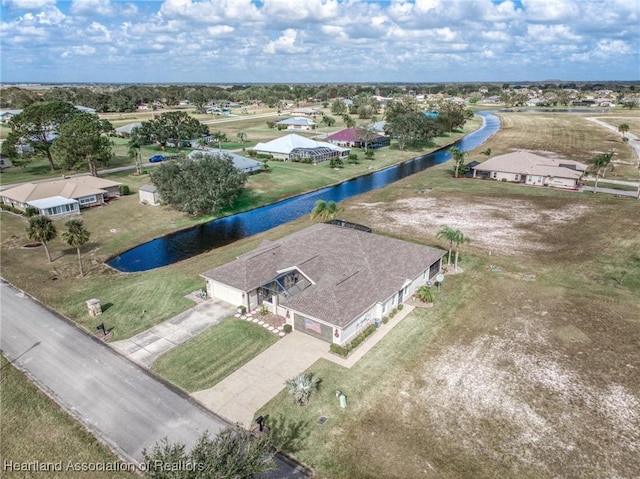 drone / aerial view with a water view