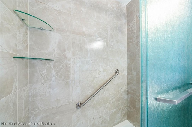 bathroom with a tile shower