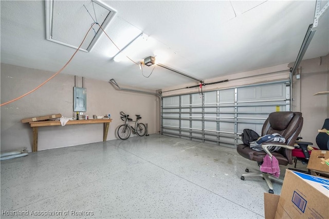 garage featuring electric panel and a garage door opener