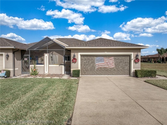 single story home with a front yard and a garage