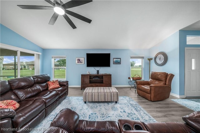 living room with light hardwood / wood-style flooring, ceiling fan, and lofted ceiling