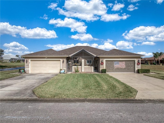 ranch-style house with a front yard and a garage