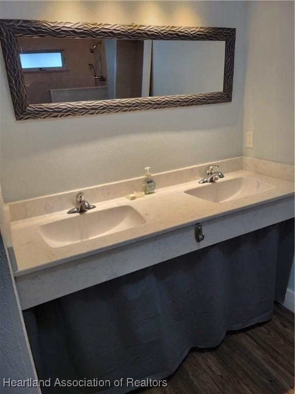 bathroom featuring vanity and hardwood / wood-style flooring