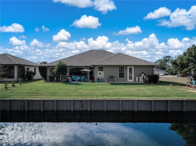 back of house with a yard