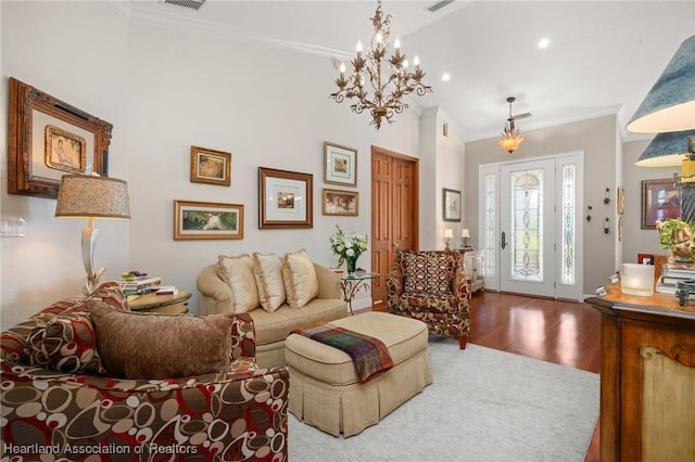 living room with hardwood / wood-style flooring and ornamental molding