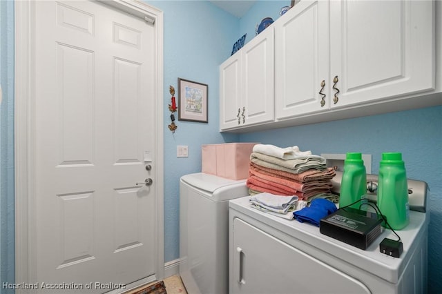 laundry area with cabinets and independent washer and dryer