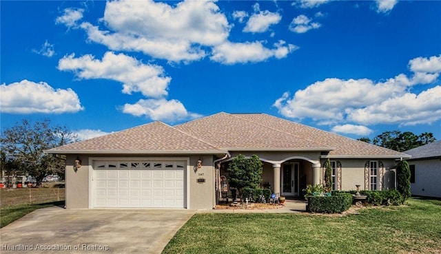 single story home with a garage and a front yard