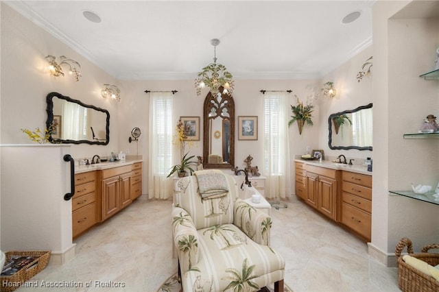 bathroom with vanity, crown molding, and a bathing tub