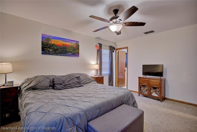 2211 Pinewood Blvd, Sebring, FL 33870 - carpeted bedroom with visible vents, baseboards, and ceiling fan