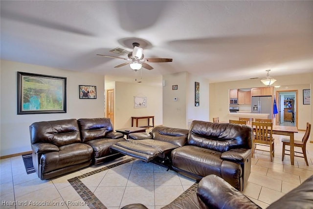 2211 Pinewood Blvd, Sebring, FL 33870 - living room with light tile patterned flooring, baseboards, a ceiling fan, and visible vents