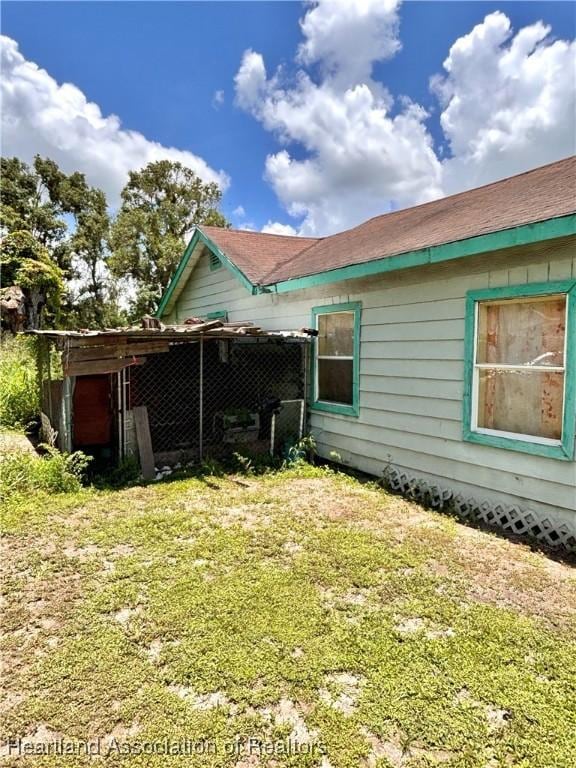 205 E Townsend St, Wauchula, FL 33873 - view of home's exterior featuring a lawn