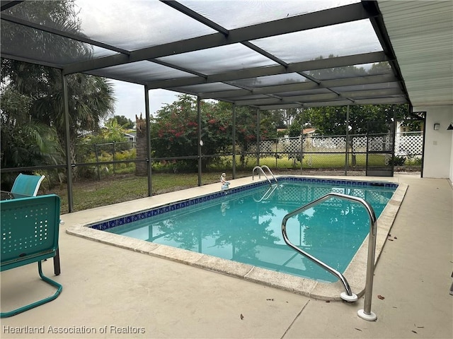 view of pool with a lanai and a patio