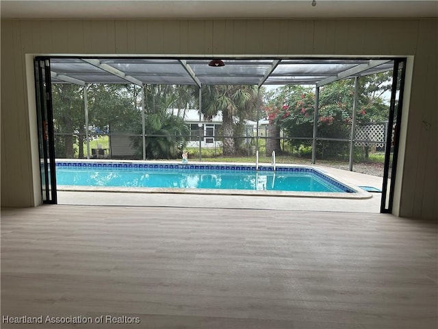 view of pool with a lanai and a patio area