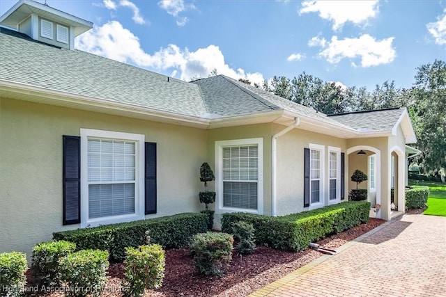 5220 Haw Rd, Sebring, FL 33875 - entrance to property featuring roof with shingles and stucco siding