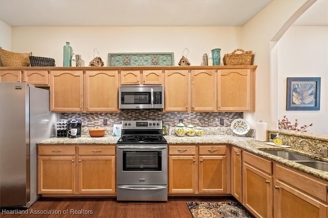 5220 Haw Rd, Sebring, FL 33875 - kitchen with stainless steel appliances, dark wood finished floors, light stone countertops, and backsplash