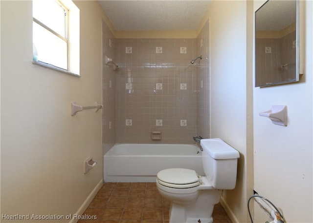 2443 W Newton Rd, Avon Park, FL 33825 - bathroom featuring baseboards,  shower combination, tile patterned flooring, a textured ceiling, and toilet
