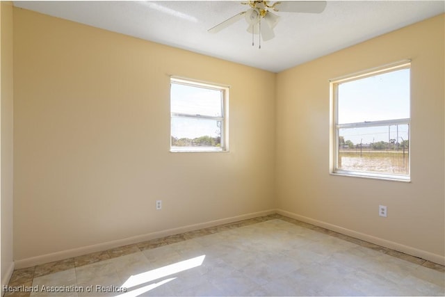2443 W Newton Rd, Avon Park, FL 33825 - spare room with a wealth of natural light, ceiling fan, and baseboards