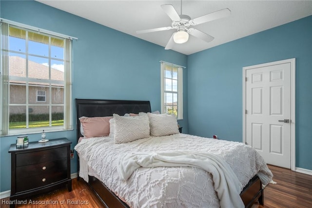 bedroom featuring ceiling fan and dark hardwood / wood-style floors