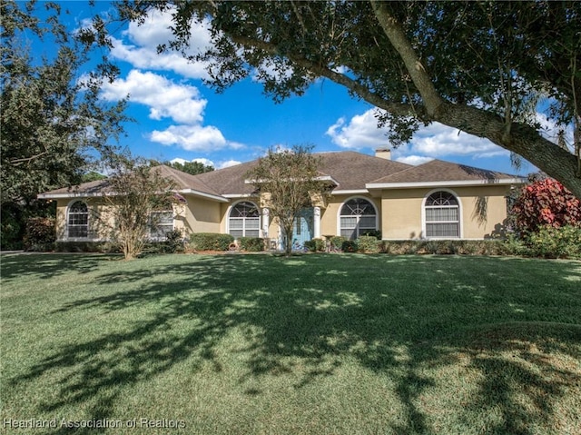 ranch-style house featuring a front lawn