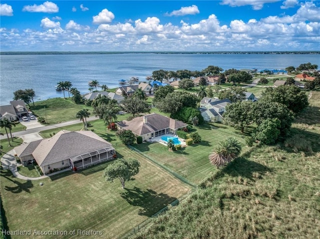 birds eye view of property with a water view