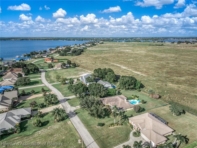 aerial view featuring a rural view and a water view