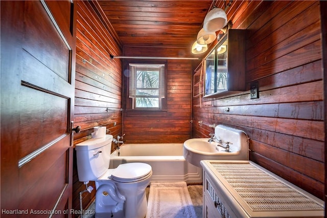 full bathroom with wooden walls, toilet, wooden ceiling, and a sink