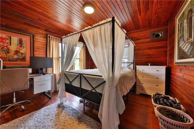 bedroom featuring dark wood-type flooring, wood walls, and wood ceiling