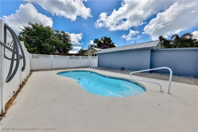 view of pool with a fenced backyard, a fenced in pool, and a patio