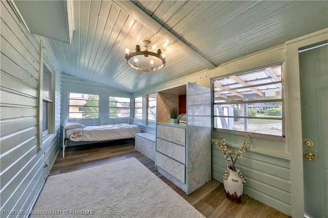bedroom featuring wooden ceiling, vaulted ceiling, a notable chandelier, and wood finished floors