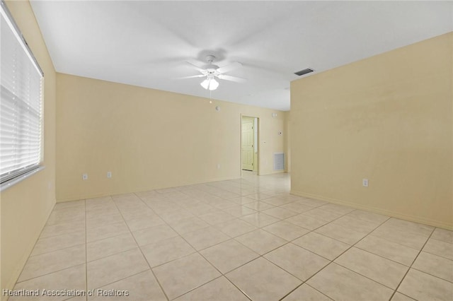 4311 Mandarin Rd, Sebring, FL 33875 - empty room with ceiling fan and light tile patterned floors