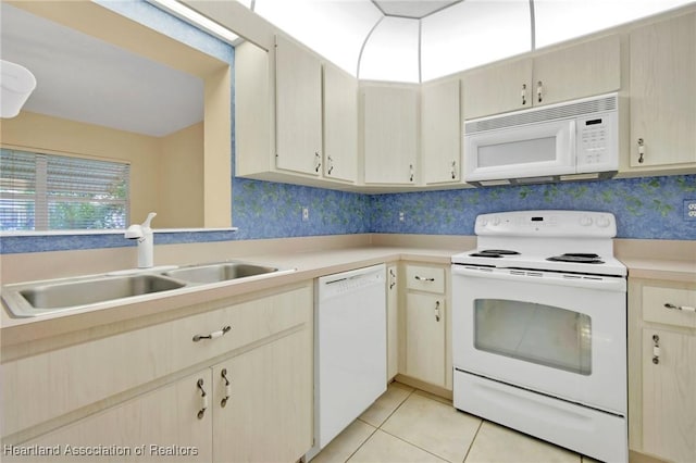 4311 Mandarin Rd, Sebring, FL 33875 - kitchen with white appliances, light countertops, and light tile patterned floors