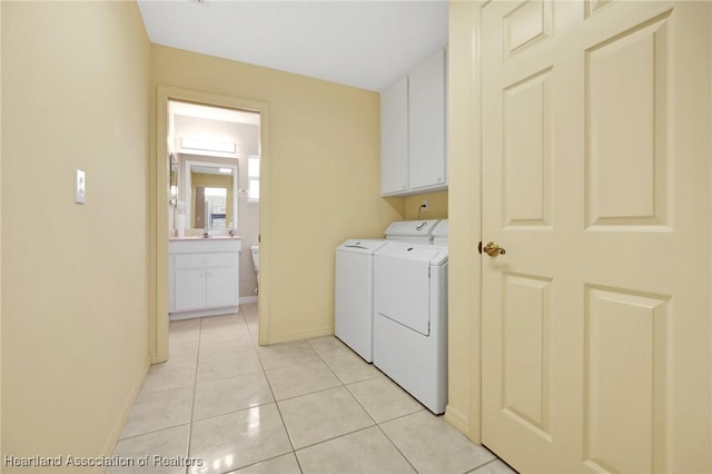 4311 Mandarin Rd, Sebring, FL 33875 - laundry area with washer and dryer, cabinet space, and light tile patterned flooring