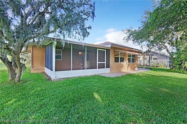 4311 Mandarin Rd, Sebring, FL 33875 - back of property featuring a yard and a sunroom