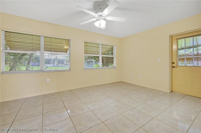 4311 Mandarin Rd, Sebring, FL 33875 - spare room with healthy amount of natural light, a ceiling fan, and light tile patterned floors