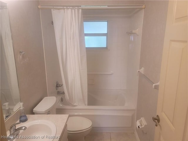 full bathroom with tile patterned flooring, toilet, vanity, and shower / bath combo with shower curtain