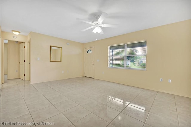 4311 Mandarin Rd, Sebring, FL 33875 - spare room with light tile patterned floors and ceiling fan