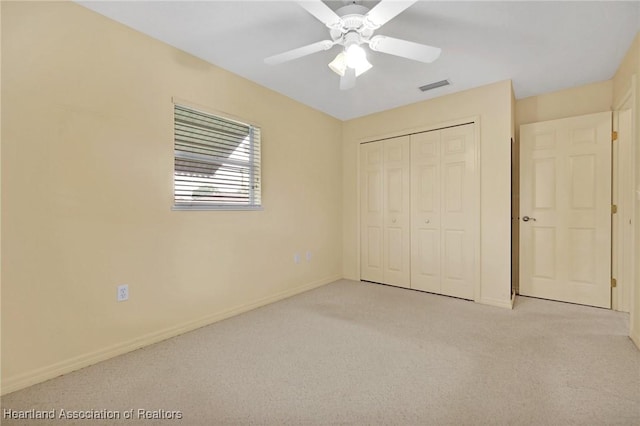 4311 Mandarin Rd, Sebring, FL 33875 - unfurnished bedroom featuring carpet flooring, a closet, and a ceiling fan