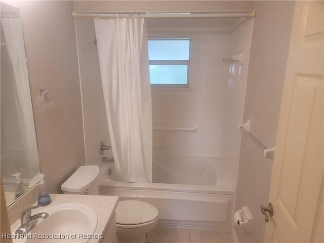 full bathroom featuring vanity, shower / tub combo with curtain, tile patterned floors, and toilet